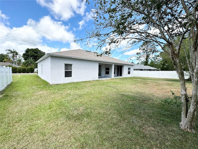 15 Ruth Dr, Palm Coast, FL 32164 - rear view of property with roof with shingles