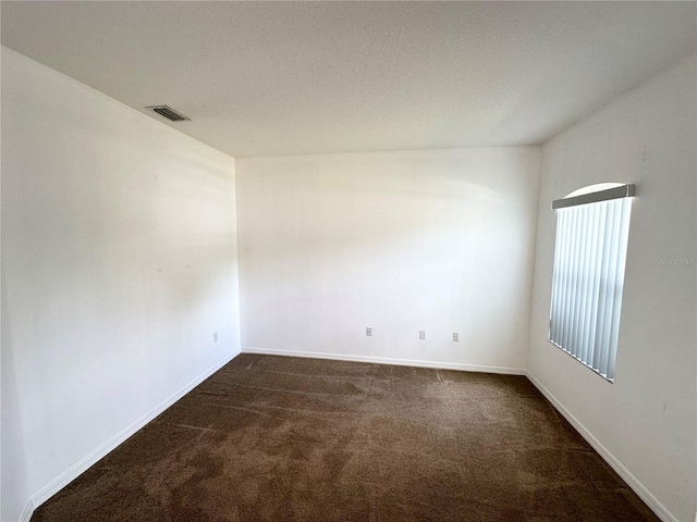 15 Ruth Dr, Palm Coast, FL 32164 - unfurnished room with dark carpet and baseboards