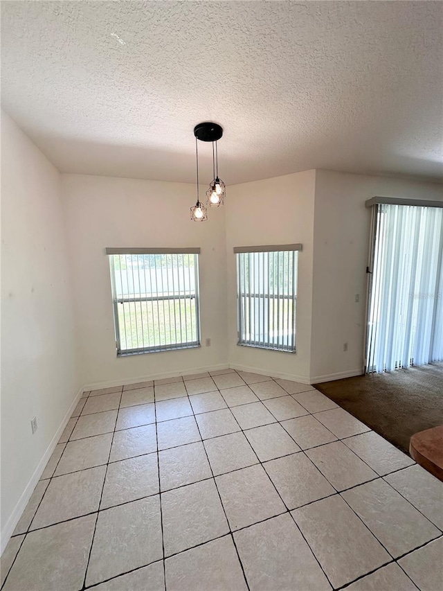 15 Ruth Dr, Palm Coast, FL 32164 - tiled spare room with a textured ceiling and baseboards