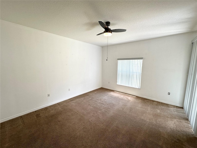 15 Ruth Dr, Palm Coast, FL 32164 - unfurnished room featuring dark carpet, ceiling fan, a textured ceiling, and baseboards