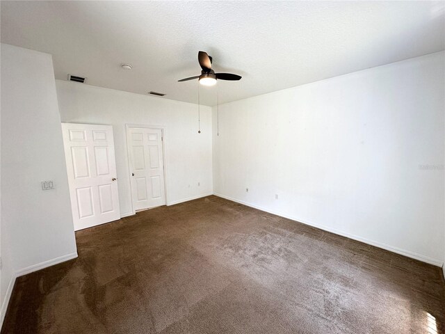 15 Ruth Dr, Palm Coast, FL 32164 - unfurnished room with a ceiling fan, dark carpet, baseboards, and a smoke detector
