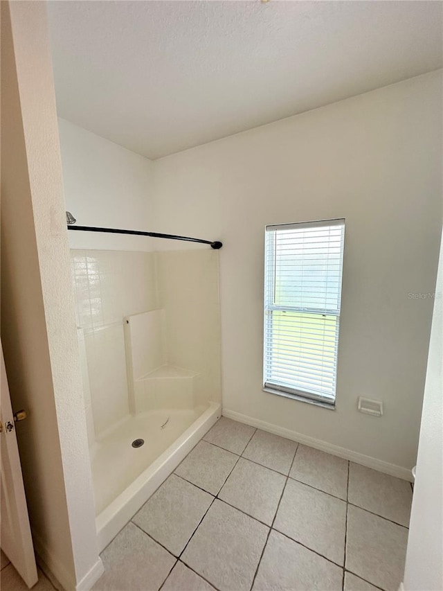 15 Ruth Dr, Palm Coast, FL 32164 - full bath with a stall shower, tile patterned floors, and baseboards