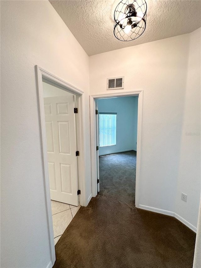15 Ruth Dr, Palm Coast, FL 32164 - hall featuring carpet floors and a textured ceiling