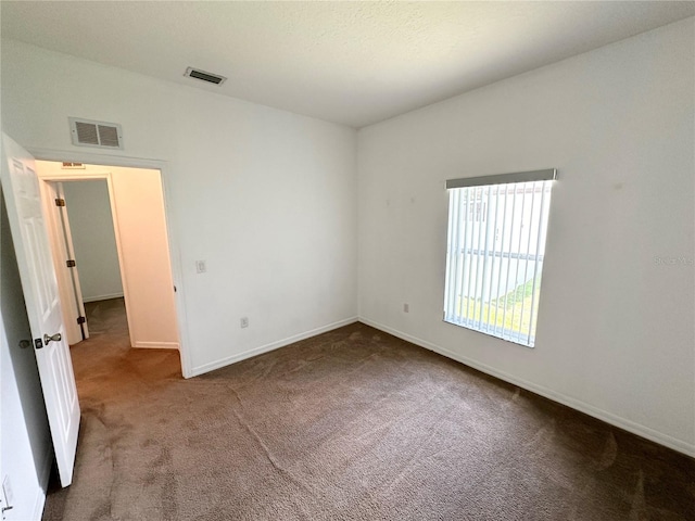 15 Ruth Dr, Palm Coast, FL 32164 - carpeted empty room with baseboards
