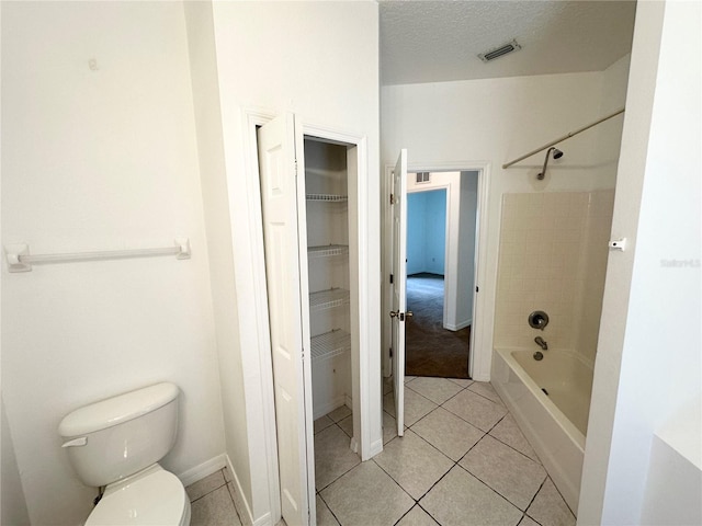 15 Ruth Dr, Palm Coast, FL 32164 - bathroom featuring tile patterned flooring, toilet, shower / bathtub combination, and baseboards
