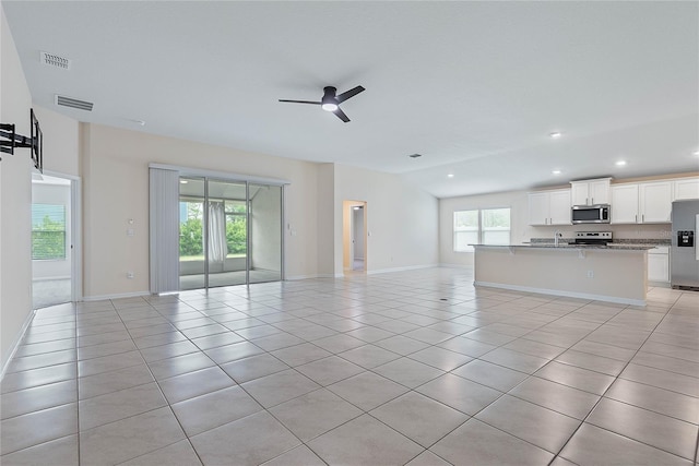 25 Red Top Ln, Palm Coast, FL 32164 - unfurnished living room with a ceiling fan, healthy amount of natural light, light tile patterned floors, recessed lighting, and baseboards