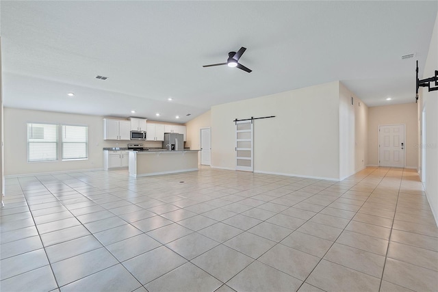 25 Red Top Ln, Palm Coast, FL 32164 - unfurnished living room featuring a barn door, light tile patterned floors, recessed lighting, a ceiling fan, and baseboards
