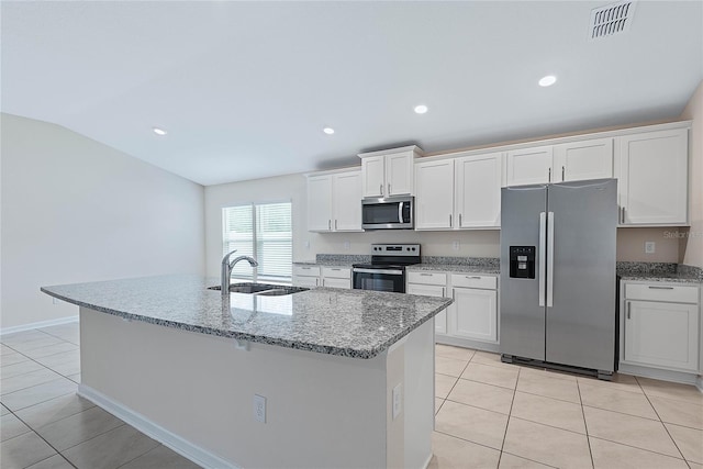 25 Red Top Ln, Palm Coast, FL 32164 - kitchen featuring stainless steel appliances, light tile patterned floors, a sink, white cabinetry, and lofted ceiling