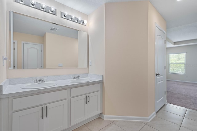 25 Red Top Ln, Palm Coast, FL 32164 - bathroom with baseboards, double vanity, and tile patterned floors
