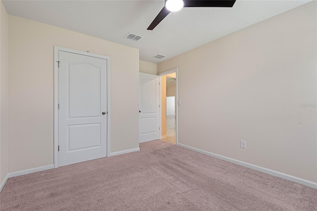 25 Red Top Ln, Palm Coast, FL 32164 - unfurnished bedroom with baseboards, carpet flooring, and ceiling fan