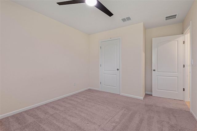 25 Red Top Ln, Palm Coast, FL 32164 - unfurnished bedroom with light colored carpet, baseboards, and ceiling fan