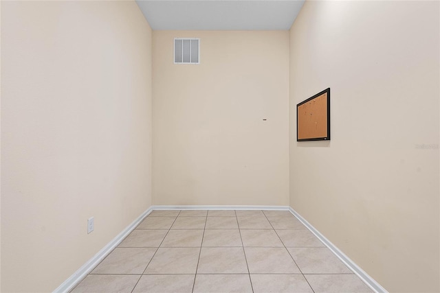 25 Red Top Ln, Palm Coast, FL 32164 - spare room featuring light tile patterned flooring and baseboards