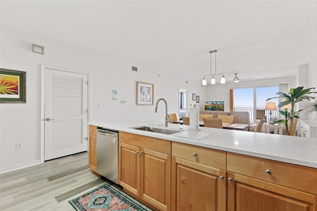 80 Surfview Dr Unit 718, Palm Coast, FL 32137 - kitchen with stainless steel dishwasher, light countertops, light wood finished floors, and open floor plan