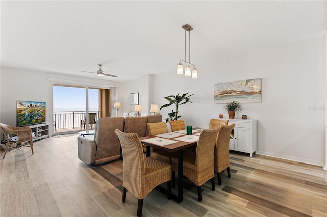 80 Surfview Dr Unit 718, Palm Coast, FL 32137 - dining room featuring light wood-style floors and ceiling fan
