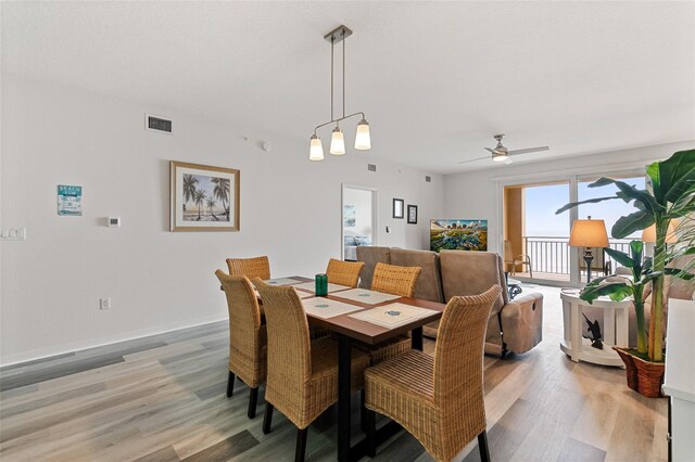 80 Surfview Dr Unit 718, Palm Coast, FL 32137 - dining area with light wood-style flooring and ceiling fan