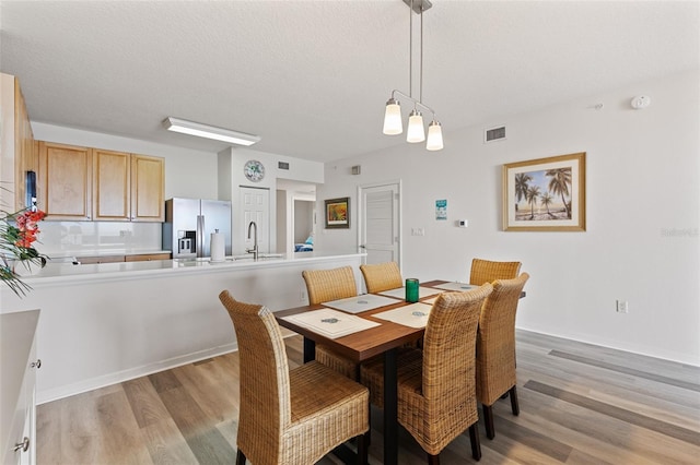80 Surfview Dr Unit 718, Palm Coast, FL 32137 - dining space featuring light wood-type flooring