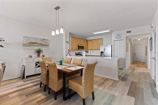 80 Surfview Dr Unit 718, Palm Coast, FL 32137 - dining space featuring light wood-style floors