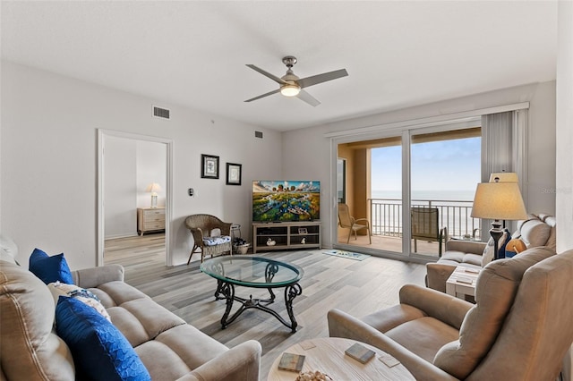 80 Surfview Dr Unit 718, Palm Coast, FL 32137 - living area featuring ceiling fan and light wood-style floors