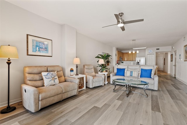 80 Surfview Dr Unit 718, Palm Coast, FL 32137 - living area featuring a ceiling fan and light wood-type flooring