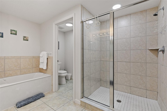 80 Surfview Dr Unit 718, Palm Coast, FL 32137 - full bathroom featuring a garden tub, a stall shower, and tile patterned floors