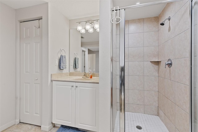 80 Surfview Dr Unit 718, Palm Coast, FL 32137 - bathroom featuring a stall shower, vanity, and tile patterned flooring