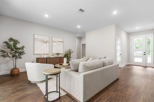 living area with baseboards, dark wood-style floors, and recessed lighting