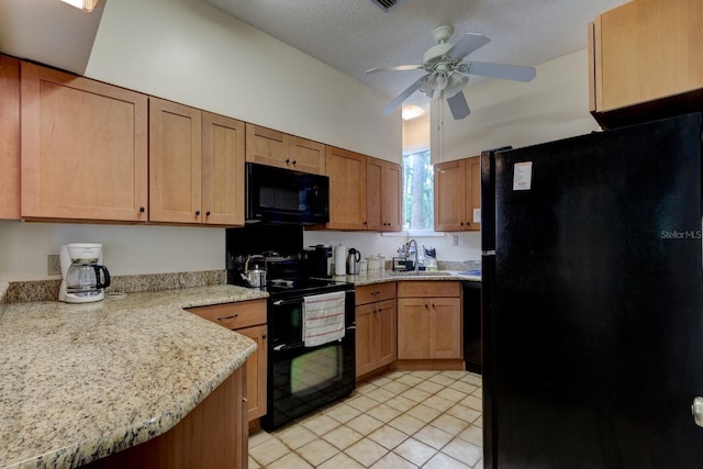 kitchen with black appliances, a sink, ceiling fan, light tile patterned flooring, and light stone countertops