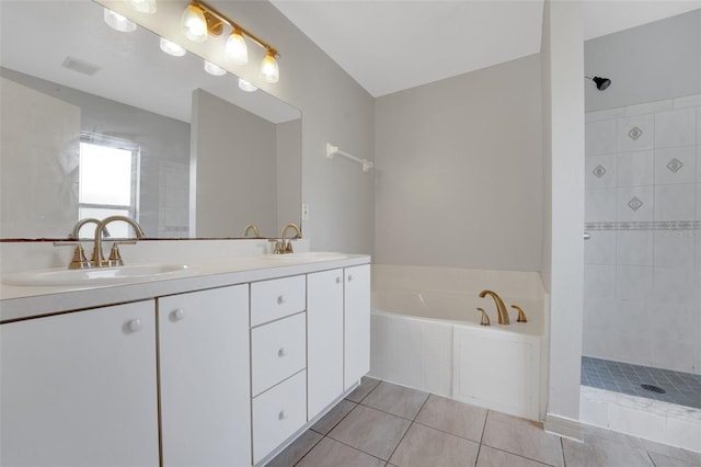 full bathroom featuring tile patterned floors, tiled shower, a bath, and double vanity