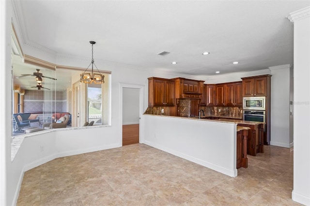 kitchen featuring stainless steel appliances, decorative backsplash, pendant lighting, recessed lighting, and a peninsula