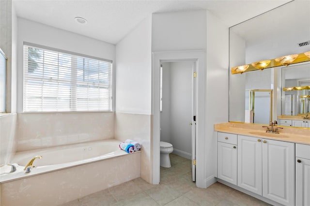 bathroom featuring vanity, a garden tub, toilet, tile patterned flooring, and a stall shower