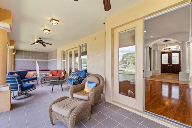 view of patio / terrace featuring french doors, ceiling fan, and an outdoor hangout area