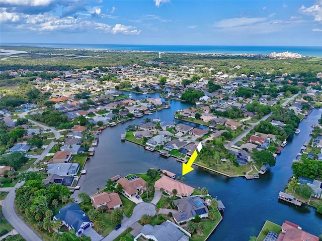 view of property location with a nearby body of water and nearby suburban area