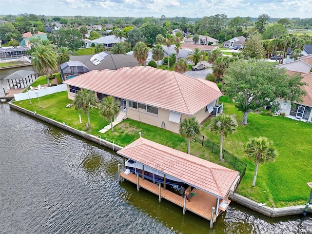 aerial view of residential area featuring a nearby body of water