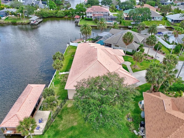 aerial view of residential area with a large body of water