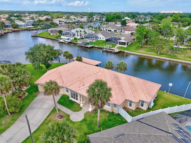 aerial perspective of suburban area with a large body of water