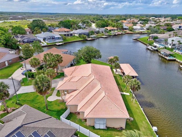 aerial perspective of suburban area featuring a large body of water