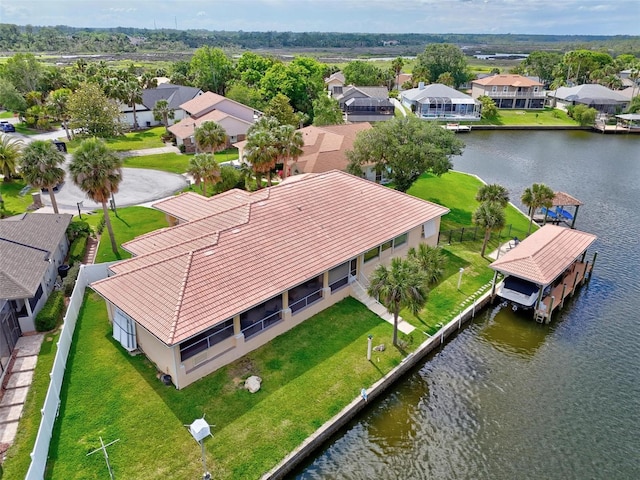 aerial perspective of suburban area featuring a nearby body of water