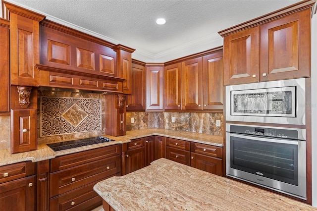 kitchen featuring appliances with stainless steel finishes, backsplash, light stone countertops, a textured ceiling, and ornamental molding