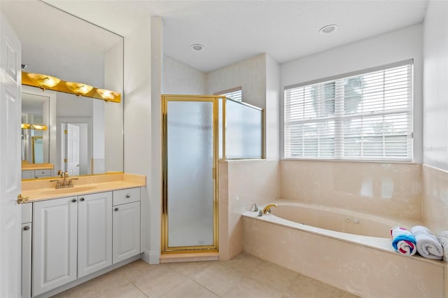 full bath featuring a stall shower, vanity, a bath, and tile patterned floors