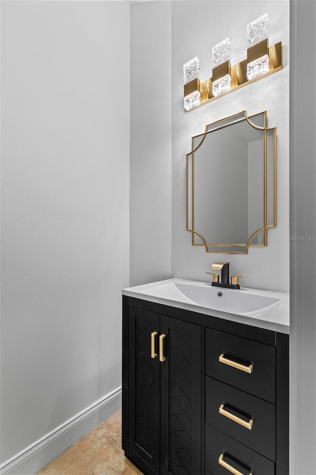 bathroom featuring baseboards and vanity