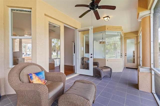 sunroom / solarium featuring french doors and healthy amount of natural light