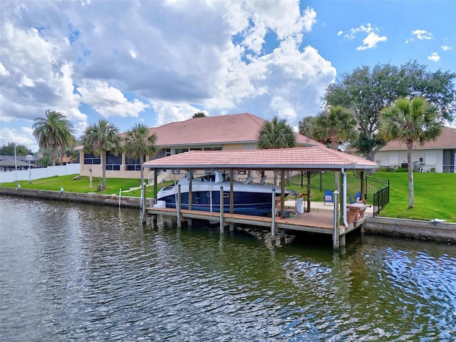 dock with boat lift and a water view