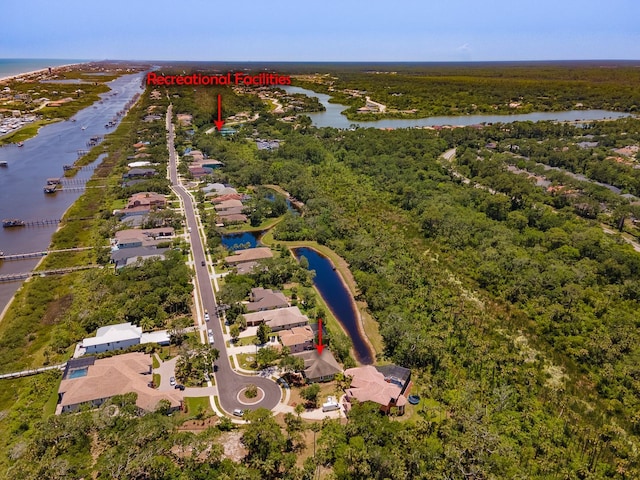 71 N Riverwalk Dr, Palm Coast, FL 32137 - aerial view of residential area featuring a large body of water and a forest
