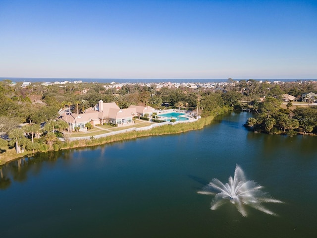 71 N Riverwalk Dr, Palm Coast, FL 32137 - aerial view of a nearby body of water, a pool area, and a tree filled landscape