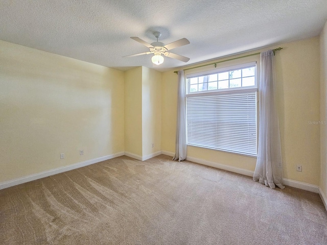 71 N Riverwalk Dr, Palm Coast, FL 32137 - carpeted spare room featuring a ceiling fan, a textured ceiling, and baseboards