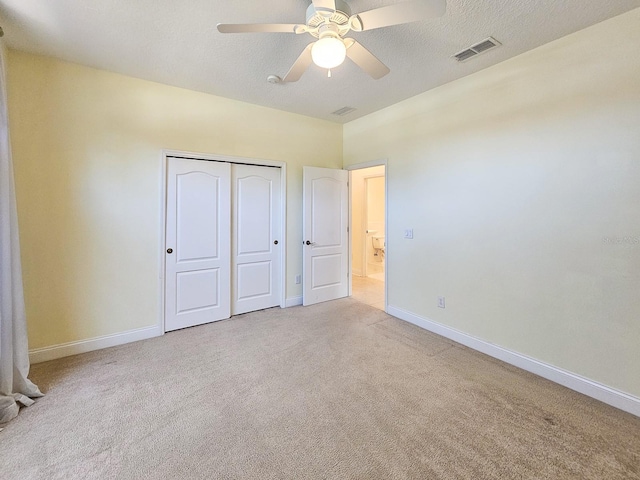 71 N Riverwalk Dr, Palm Coast, FL 32137 - unfurnished bedroom featuring carpet floors, baseboards, a closet, and ceiling fan