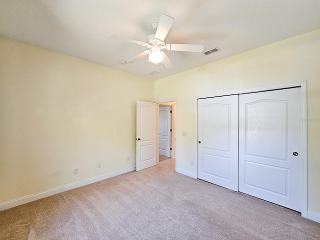 71 N Riverwalk Dr, Palm Coast, FL 32137 - unfurnished bedroom featuring carpet flooring, baseboards, a closet, and ceiling fan