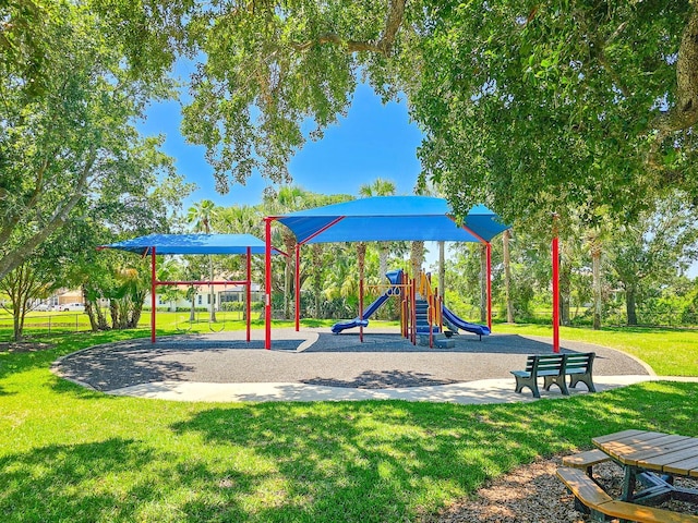 71 N Riverwalk Dr, Palm Coast, FL 32137 - community play area with a lawn