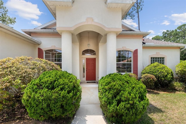 91 Breeze Hill Ln, Palm Coast, FL 32137 - entrance to property with stucco siding and a shingled roof