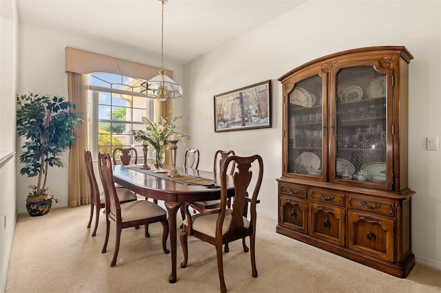 91 Breeze Hill Ln, Palm Coast, FL 32137 - carpeted dining area featuring a chandelier